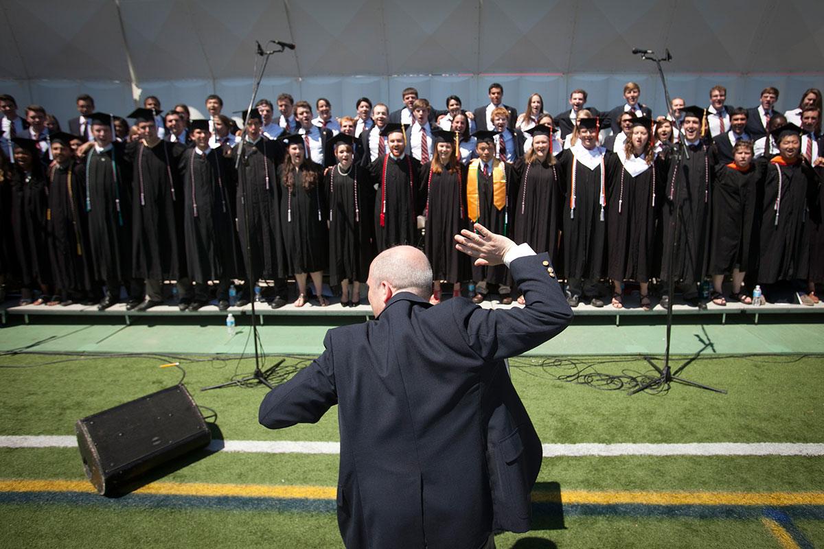 Robert Isaacs conducts the Cornell Chorus at the 2014 Commencement Ceremony.
