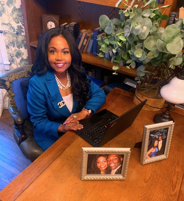 Marjorie McFarlane Lucas, MPS ’17 sitting at her desk