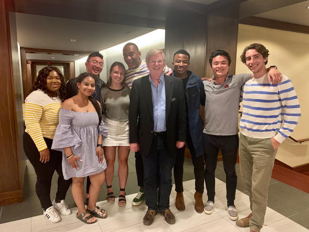 Bill Sonnestuhl standing with a group of TAs in a hallway