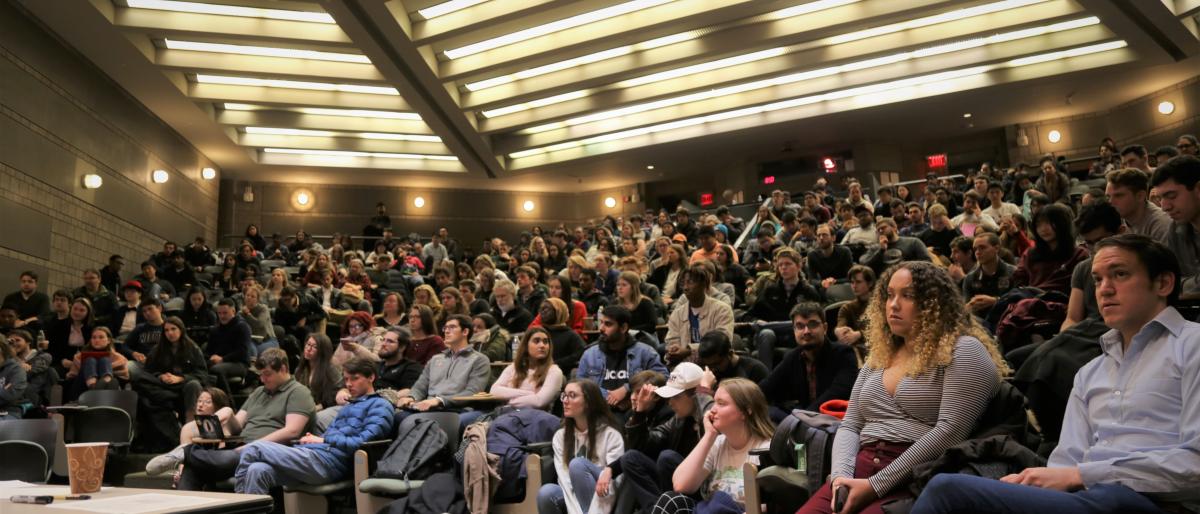 Worlds debate tournament competitors on the ILR campus, congregating in the great hall of Ives room number 305