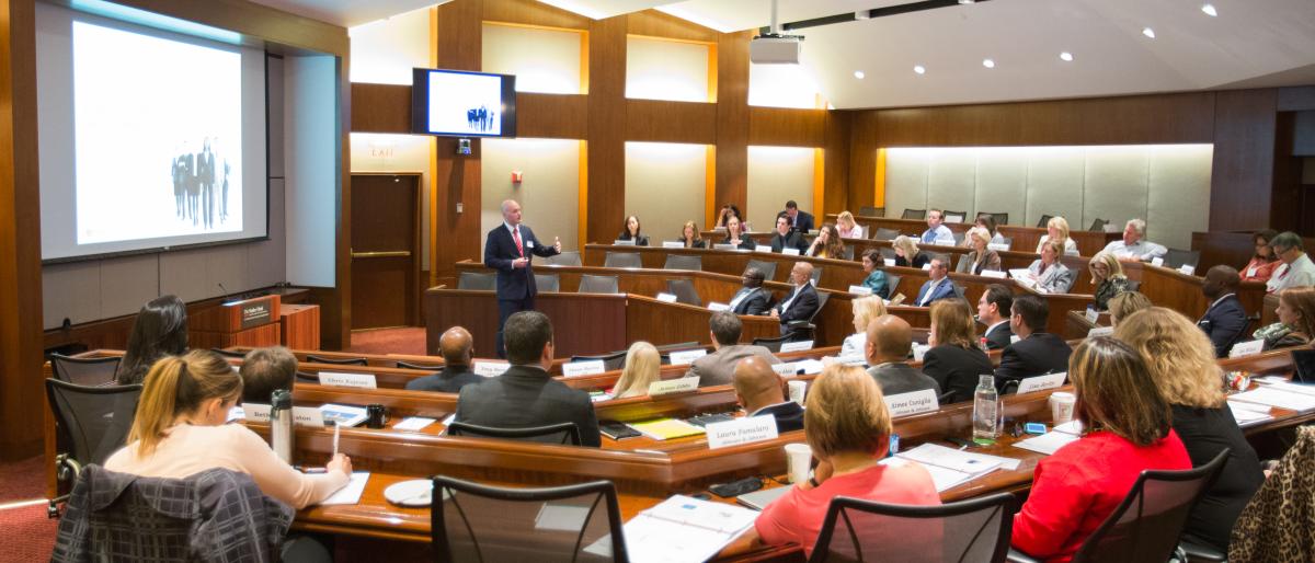 CAHRS Partners and faculty meeting to learn in a lecture hall