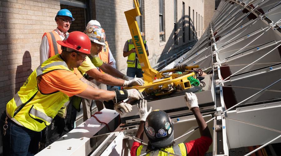 Construction workers building a skylight