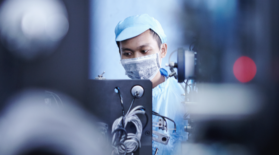 Scientific technical worker wearing a mask