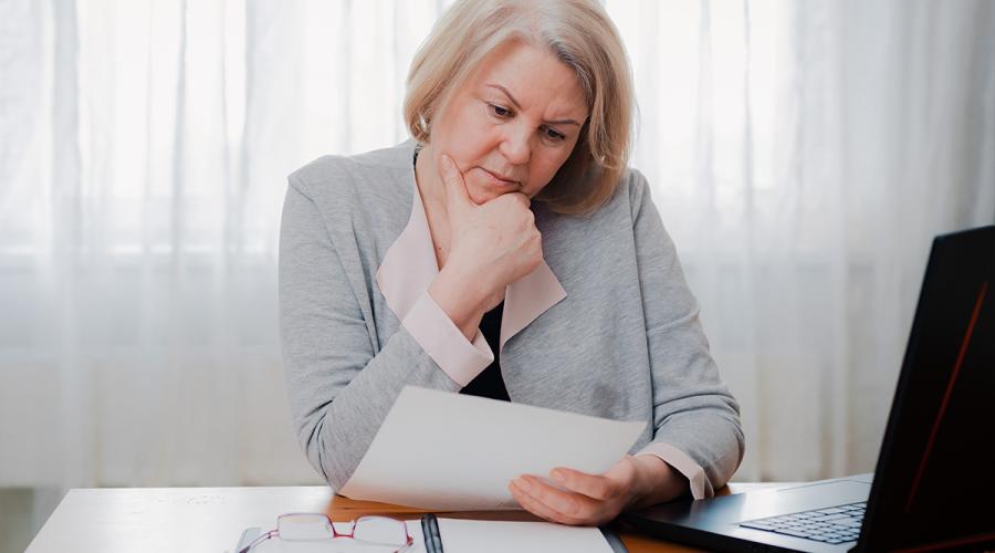 middle-aged woman working at a desk