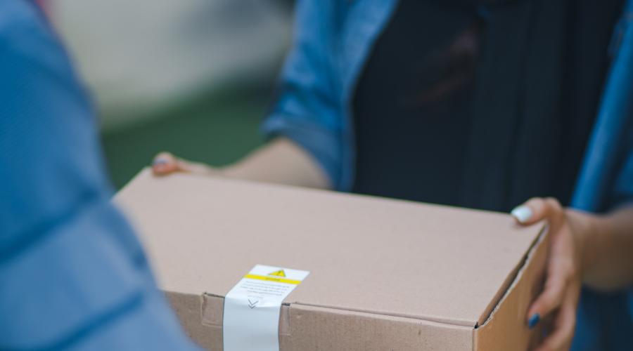 photo of a box being delivered to illustrate frontline workers