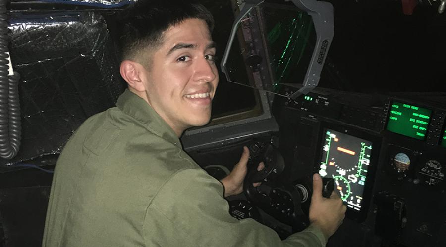 Michael Sanchez ’23 sitting in a military helicopter
