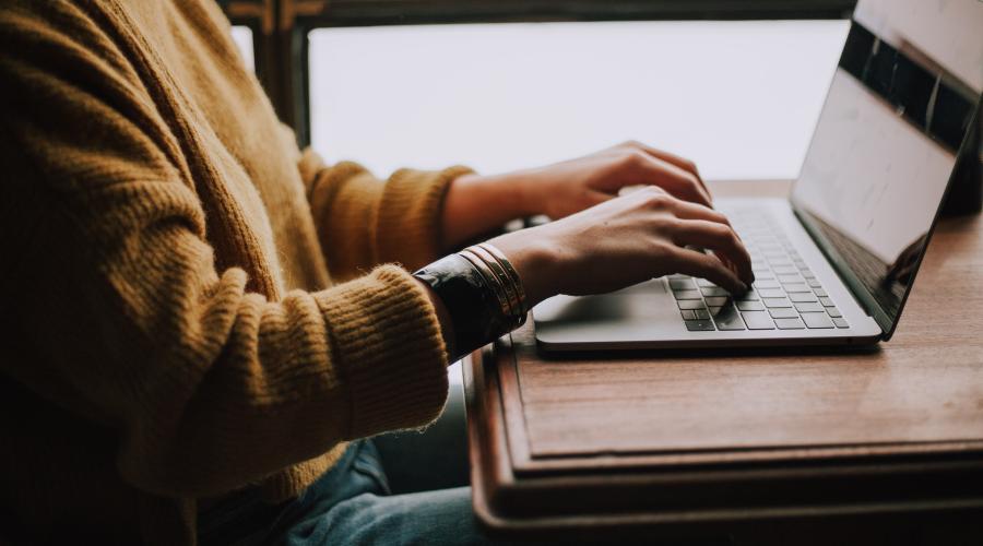 Photo of person typing by Christin Hume on Unsplash