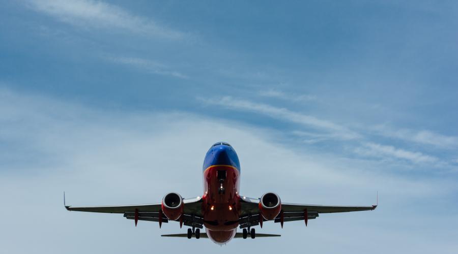 Photo of airliner in the sky by Gary Lopater on Unsplash