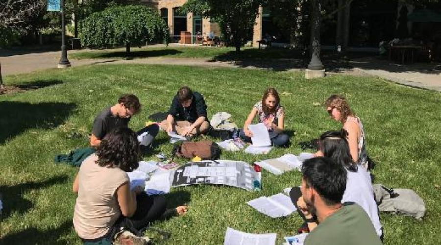 SCR Students working on the grass