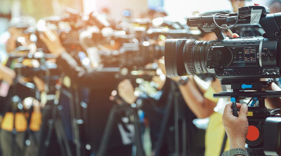 Journalists and photographers at a press conference