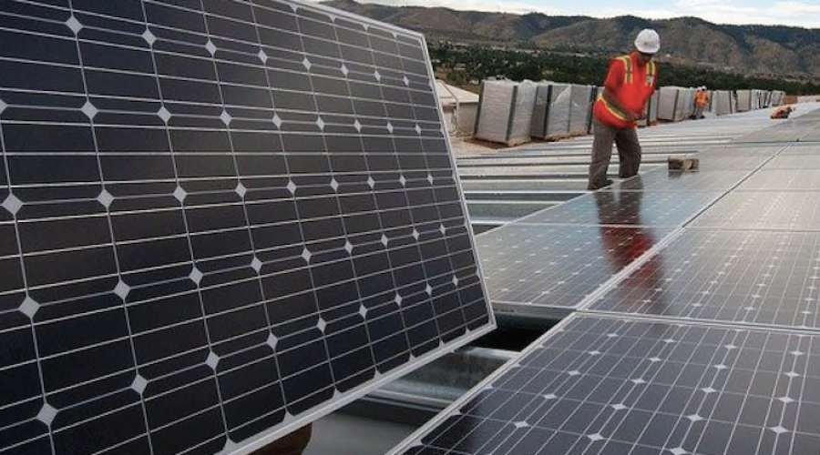 Man installing solar panels