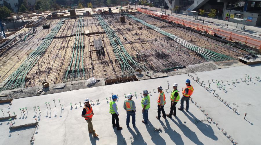 Cover image for Nicholas Saleh's testimonial, picturing some contractors - relevant to Saleh's research topic.