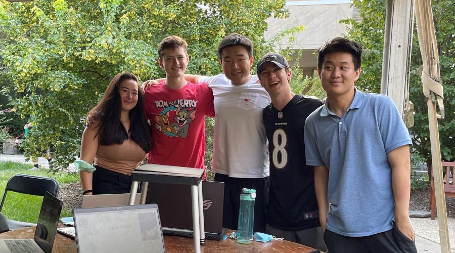 Student members of the policy team pose together outside during fall semester
