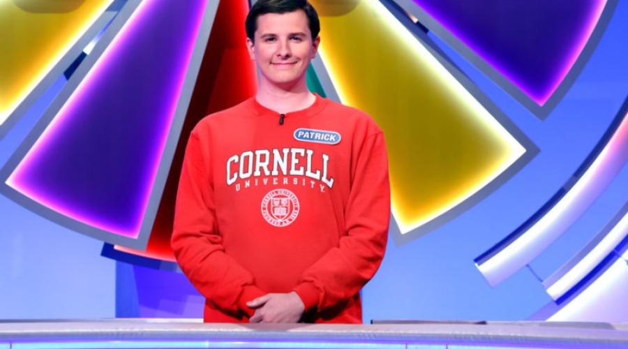 Patrick Mehler standing in front of the wheel on Wheel of Fortune.