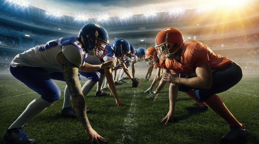 Two football teams at the line of scrimmage