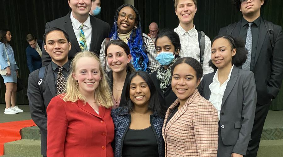Students stand in a group after a speech tournament