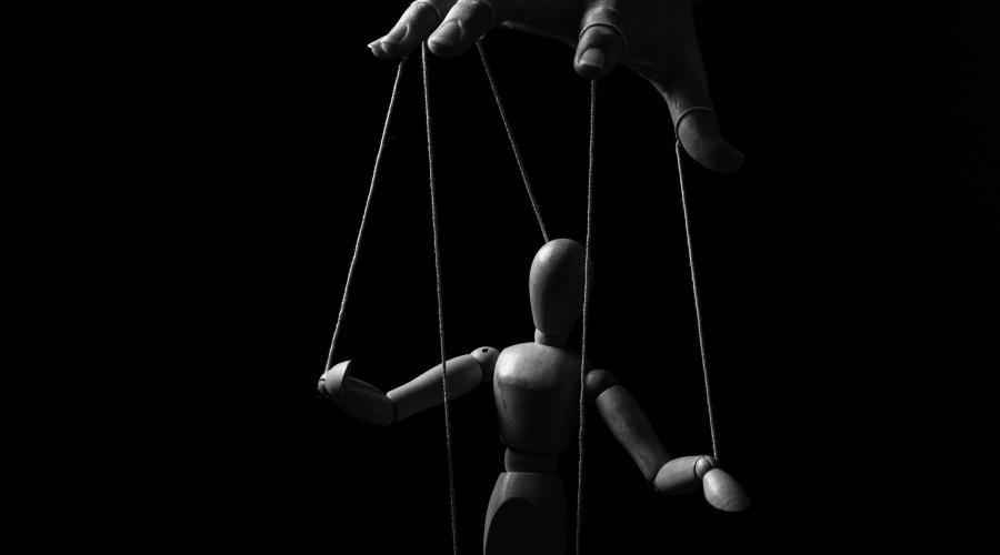 Hand manipulating a marionette