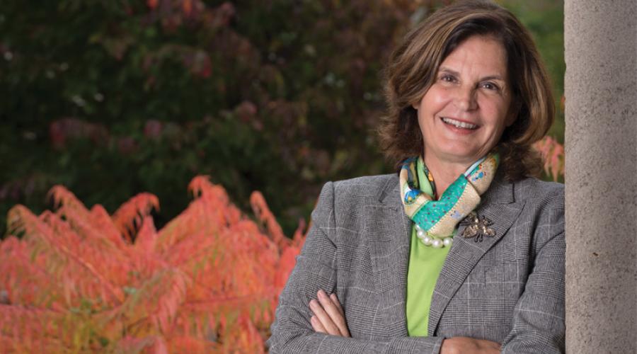 Kathleen Weslock, M.S. ’83 poses in the ILR quad.