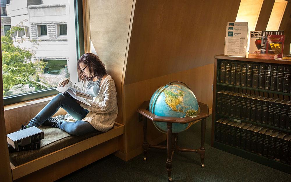 Studying in the window bay at the Catherwood Library