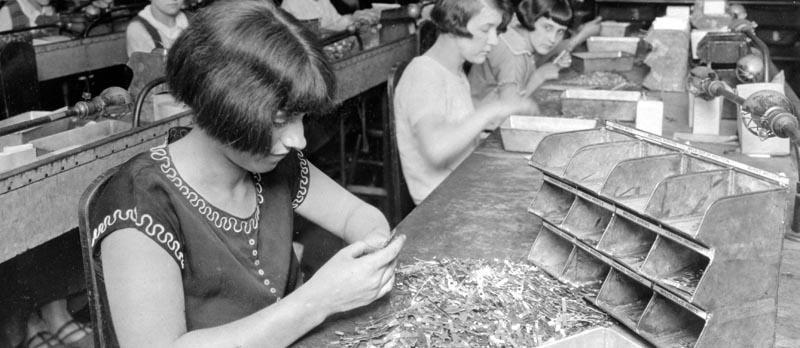 archive photo of a person sorting materials at work