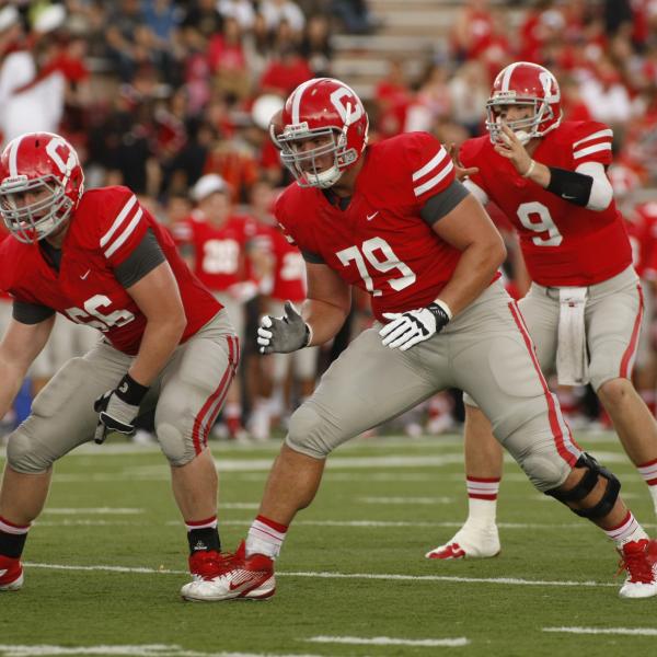 JC Tretter (#79) on the offensive line protecting Jeff Mathews’ (#9) blindside in a game vs. Yale in 2012 at Schoellkopf Field (Tim McKinney).