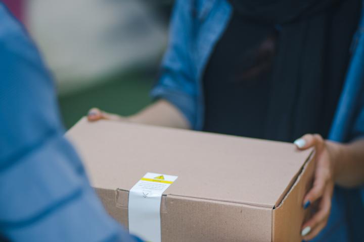 photo of a box being delivered to illustrate frontline workers