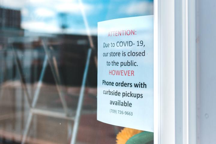 Sign on store door stating that they are closed but pickups can be scheduled.