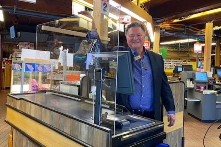 Stew Leonard Jr., president of the chain, in the Norwalk, Conn., store on Tuesday, behind one of the Plexiglas barriers. Credit: Stew Leonard’s  By Tory N. Parrish