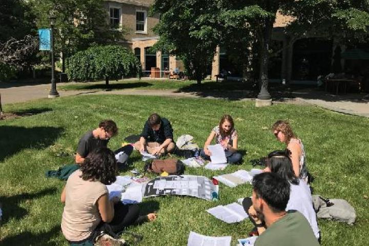 SCR Students working on the grass