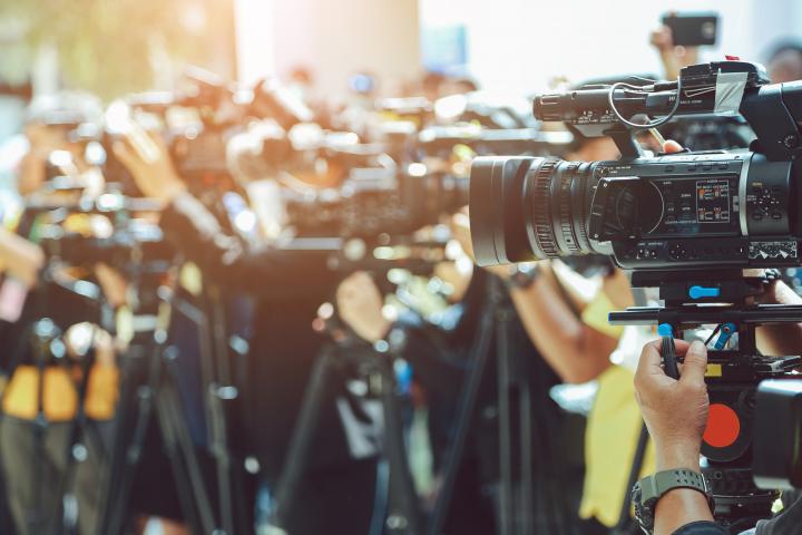 Journalists and photographers at a press conference