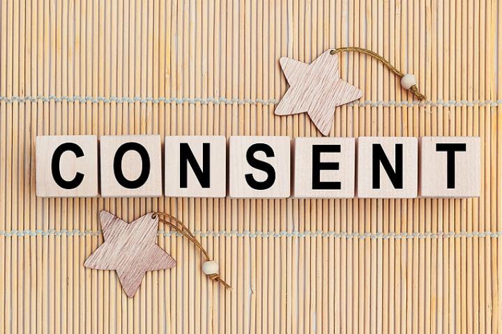 The word "consent" written on blocks