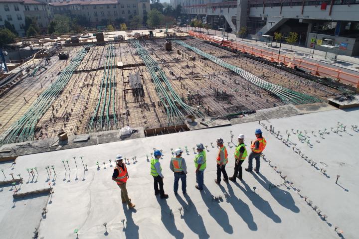 Cover image for Nicholas Saleh's testimonial, picturing some contractors - relevant to Saleh's research topic.