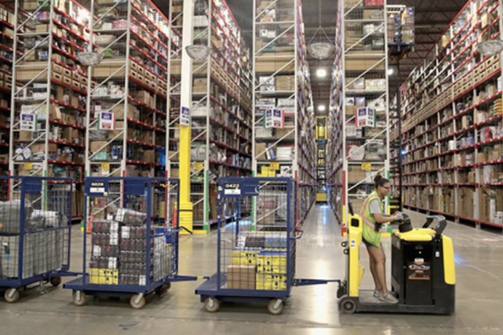 Workers pack and ship customer orders at the 750,000-square-foot Amazon fulfillment center in Romeoville, Ill. Source: Scott Olson/Getty Images