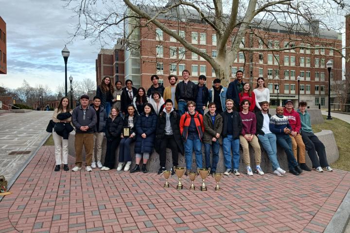 20 Cornell Debaters stand together before the tournament