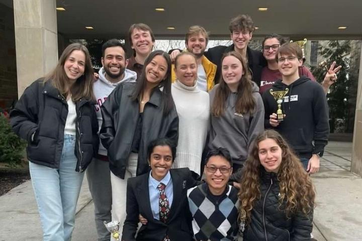 A group of students pose in front of Ives Hall