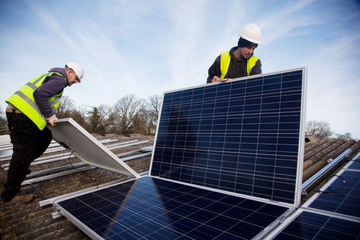 Solar workers installing panels