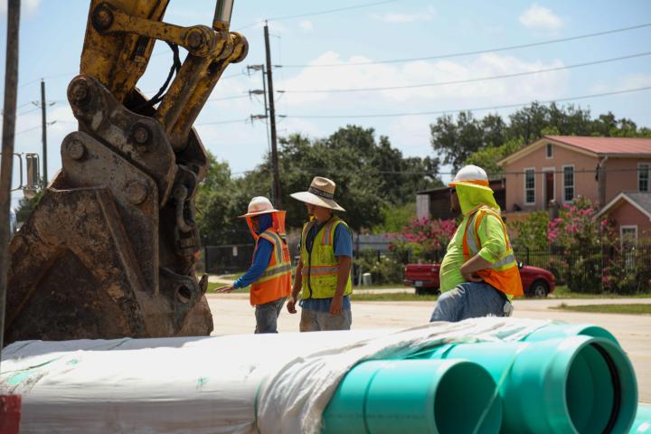 A photo of constructions workers at a construction site