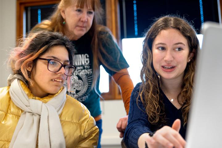 TST-BOCES student Isa Santos (left) works with her teacher Helen Staller (center) and Kathryn Erich '26 (right), public relations chair for the TST-BOCES Career Skills Club. Photo courtesy of Sreang Hok/Cornell University.