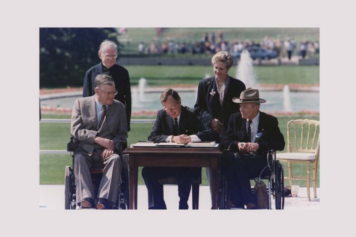 President Bush Signs into Law the Americans with Disabilities Act of 1990 on the South Lawn of the White House