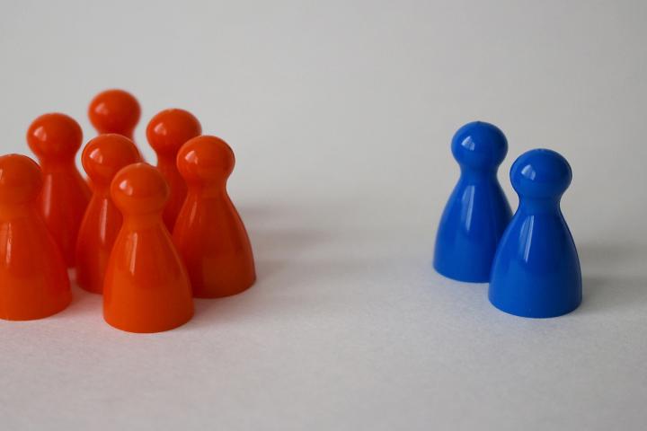 Red and blue pawns are separated into groups