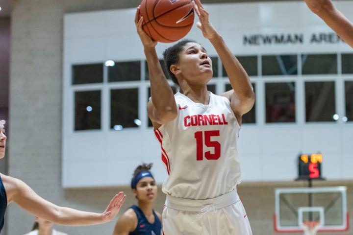 Theresa Grace Mbanefo shoots the ball over a defender during the Cornell Big Red women's basketball team's contest against Duquesne on Tuesday, Dec. 10, 2019 in Newman Arena in Ithaca, NY. (Eldon Lindsay/Cornell Athletics)