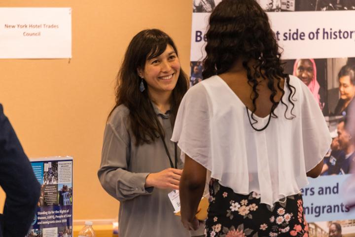 An ILR student speaks with a representative fo the New York Hotel Trades Council at the 2019 Social Justice Career Fair. 