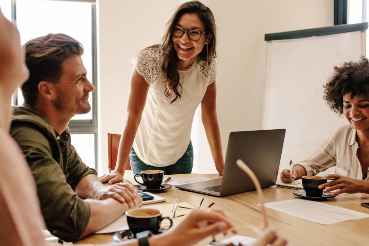 Employees at a startup hold a meeting