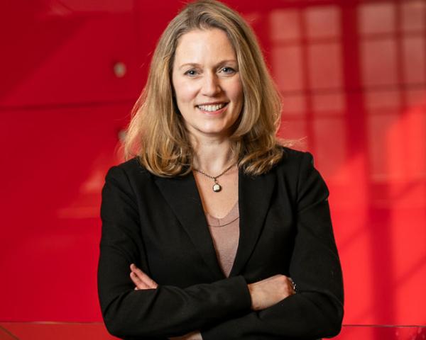 Associate Professor Vanessa Bohns in the hallway of the Ives Faculty Building.