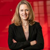 Associate Professor Vanessa Bohns in the hallway of the Ives Faculty Building.